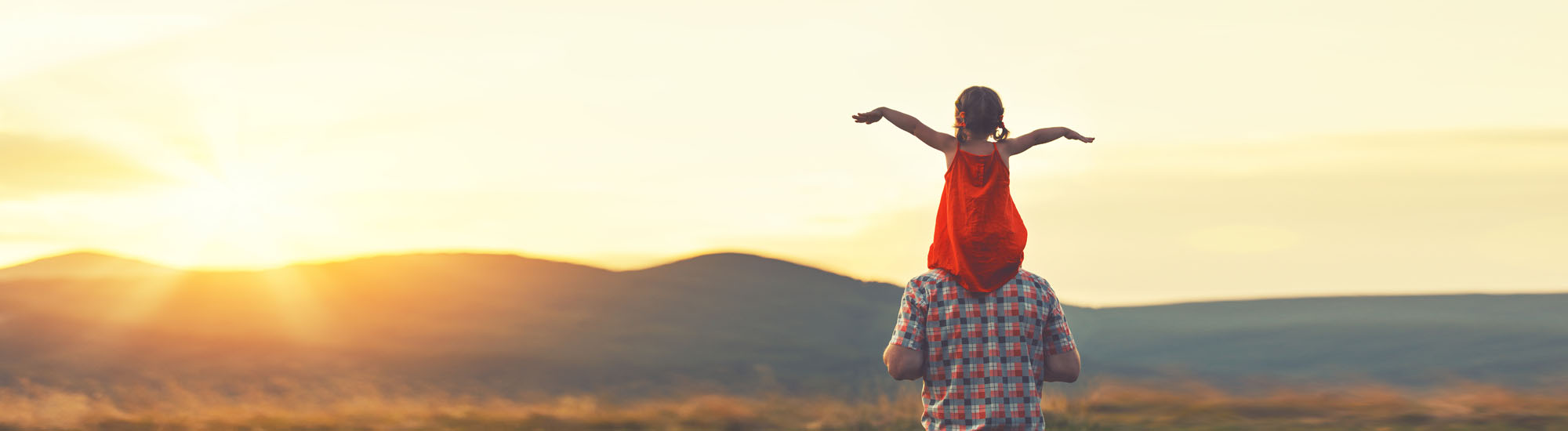 Daughter on Dad's shoulders